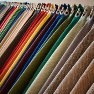 Line of hanging textured fabrics of different colors and shades